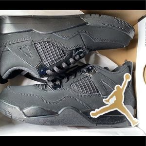 Black cat Jordan 4s